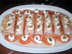 Ham in jelly rolls stuffed with russian salad